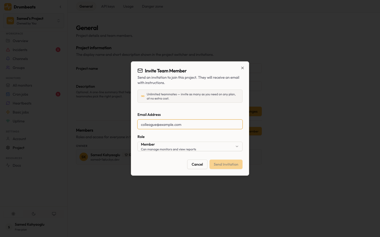 The Invite Team Member dialog in Project Settings, with the email field, role dropdown, and the "Unlimited teammates" banner